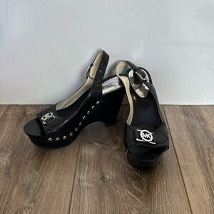 Michael Kors’s black leather heel wedges – size 8